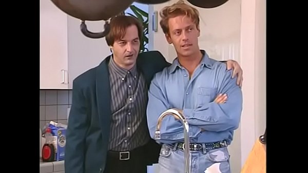 Brunette slides her cunt onto ripped dude'_s cock as second babe licks his balls